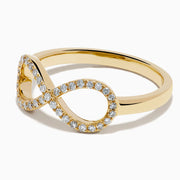 The 14K Yellow Gold Diamond Infinity Pinky Ring features an infinity symbol encrusted with small diamonds, creating a stunning statement piece against a plain white background.