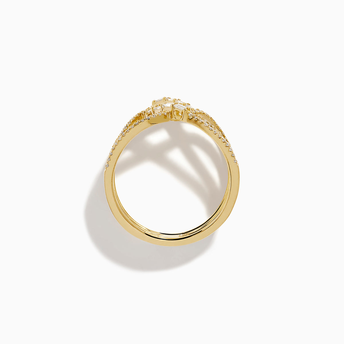 The D'Oro 14K Yellow Gold Interlaced Crisscross Diamond Ring features overlapping bands adorned with small diamonds and baguette-cut stones in a striking crisscross pattern, displayed on a white background.