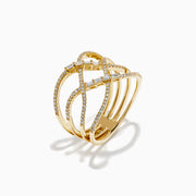 The D'Oro 14K Yellow Gold Interlaced Crisscross Diamond Ring features overlapping bands adorned with small diamonds and baguette-cut stones in a striking crisscross pattern, displayed on a white background.