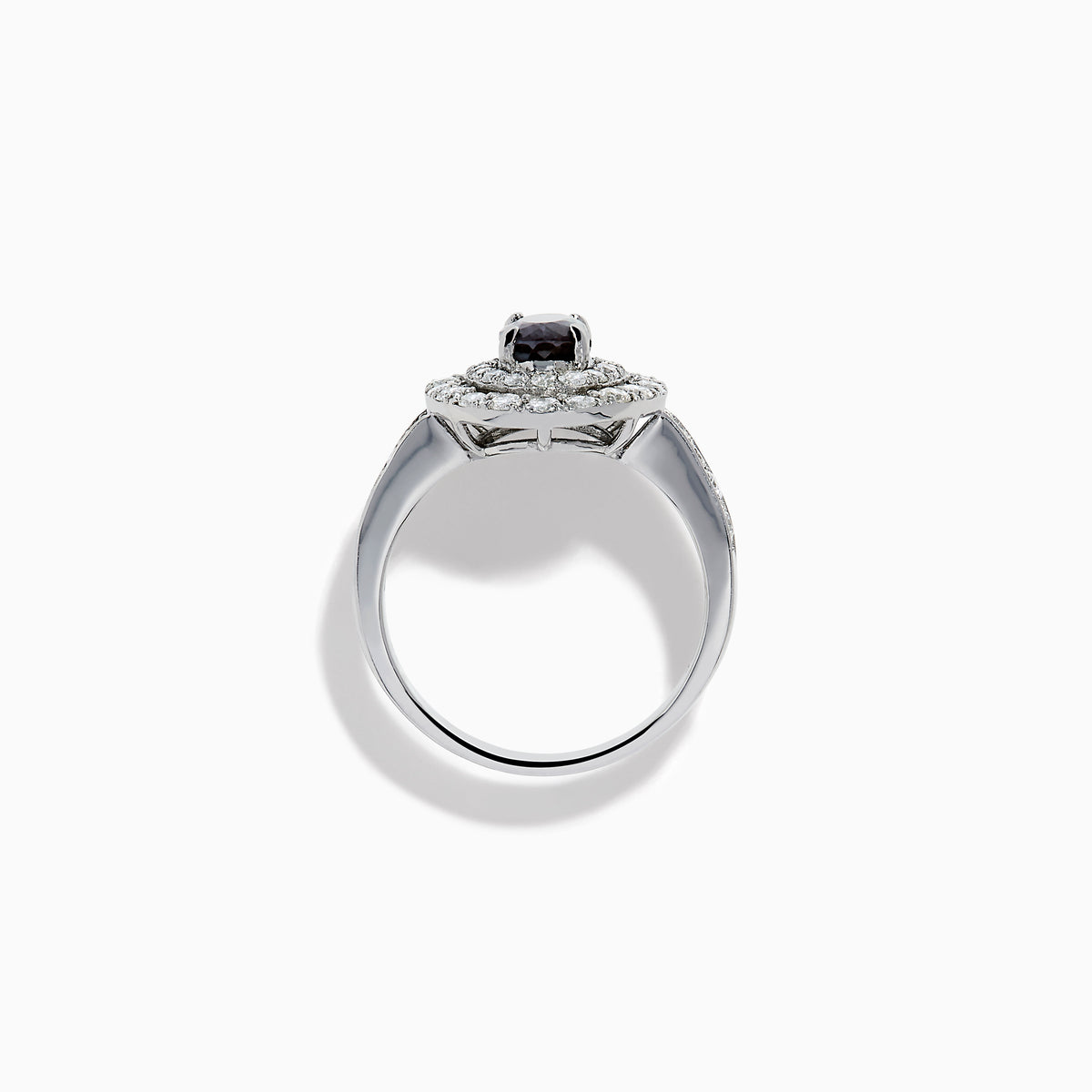 The Platinum GIA Certified Alexandrite and Diamond Double Halo Ring showcases an oval dark blue Alexandrite center stone, two rows of sparkling round diamonds in a double halo, and additional diamonds on the band, all set against a white background.
