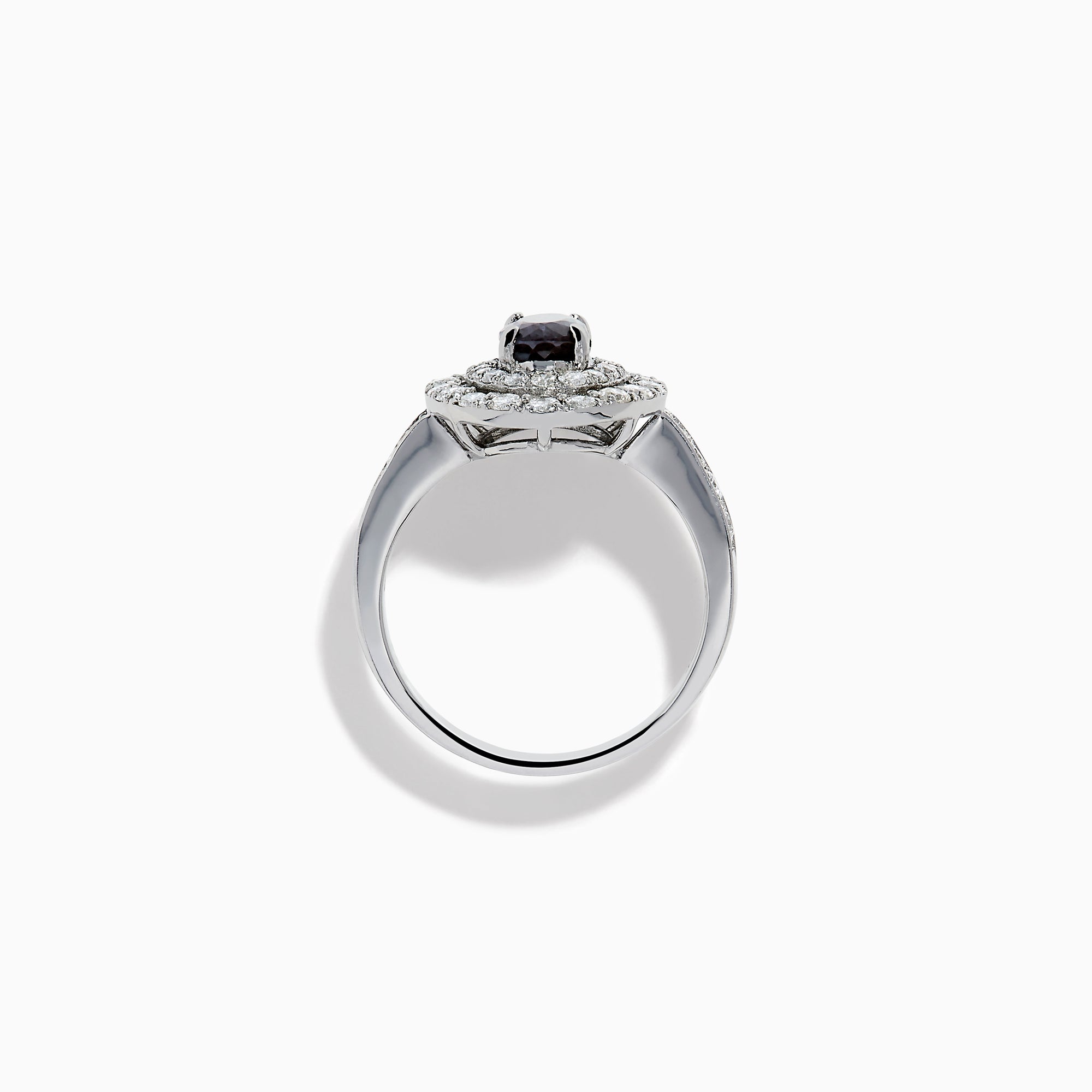 The Platinum GIA Certified Alexandrite and Diamond Double Halo Ring showcases an oval dark blue Alexandrite center stone, two rows of sparkling round diamonds in a double halo, and additional diamonds on the band, all set against a white background.