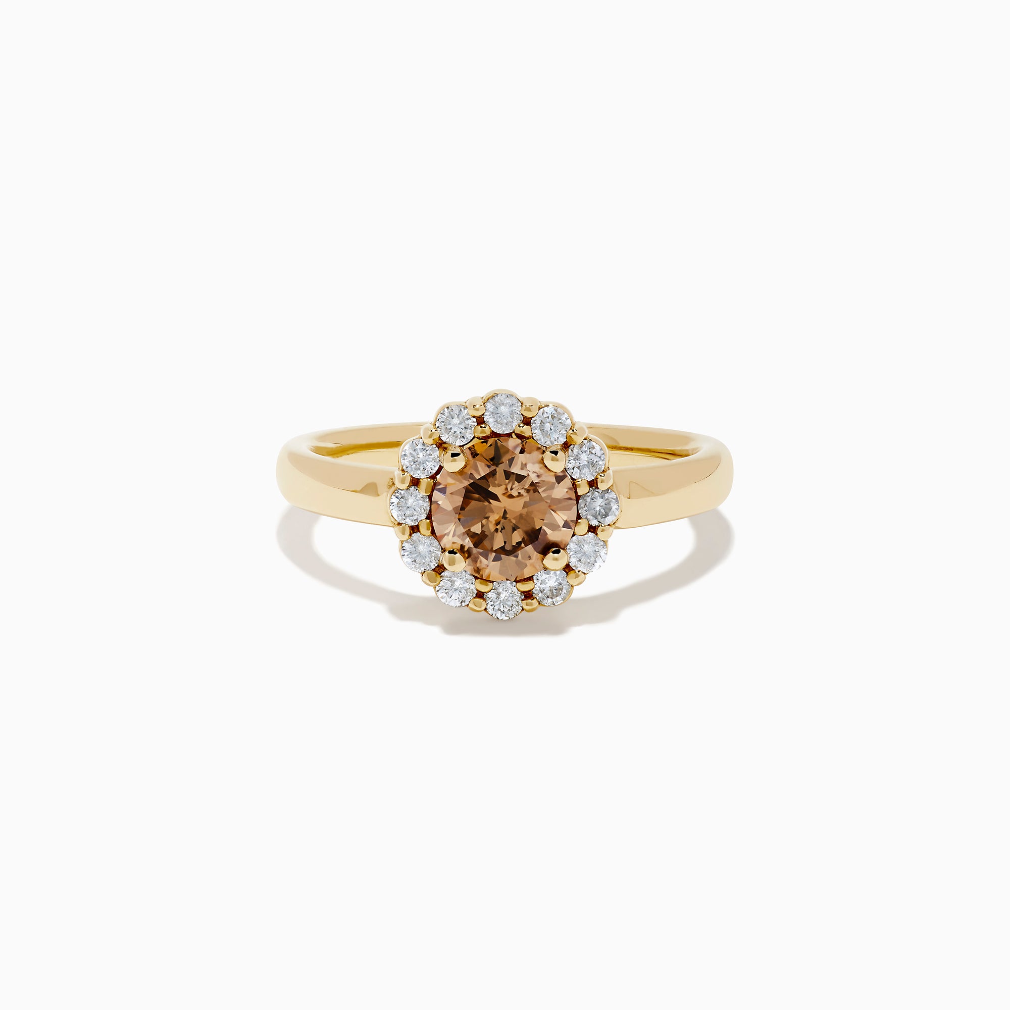 The 14K Yellow Gold Brown and White Diamond Halo Ring features a round brown and white diamond center, accented by a halo of sparkling small white diamonds.