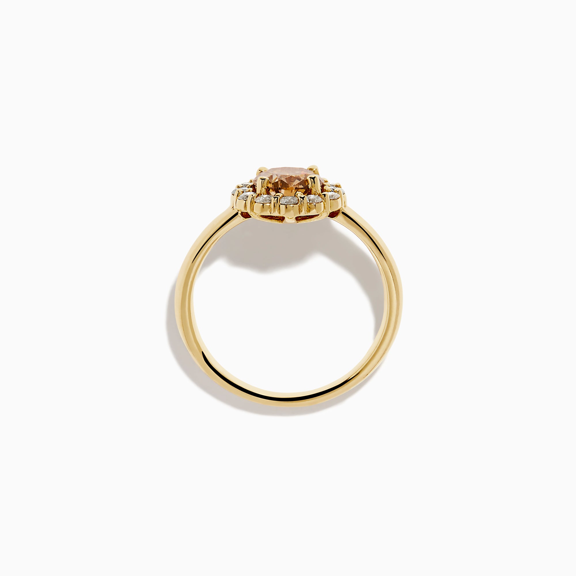 The 14K Yellow Gold Brown and White Diamond Halo Ring features a round brown and white diamond center, accented by a halo of sparkling small white diamonds.