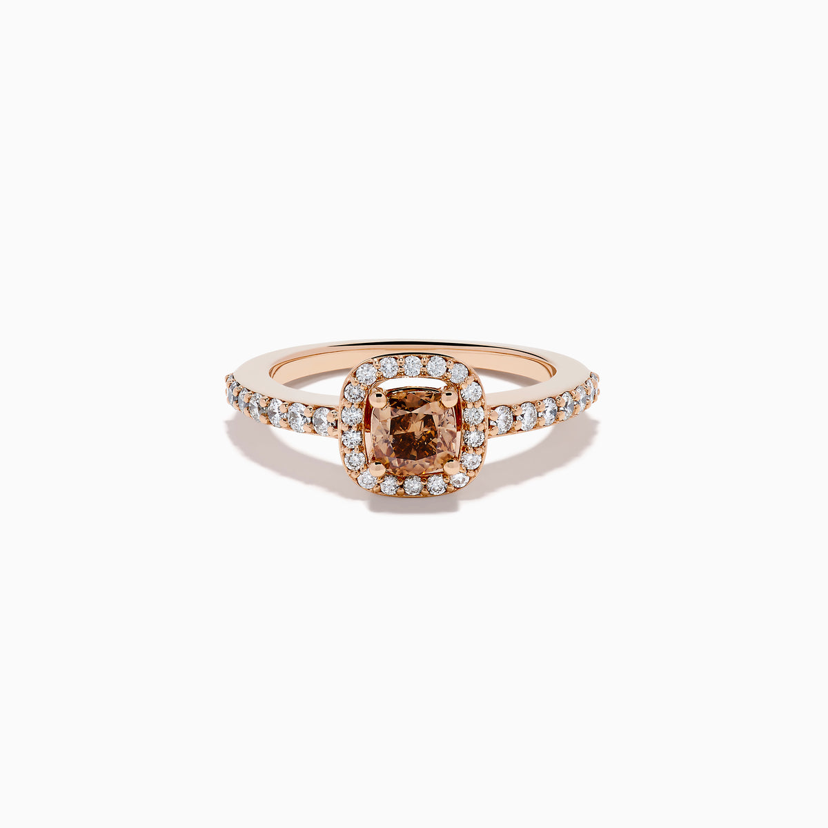 The Espresso 14K Rose Gold Brown and White Diamond Ring showcases a cushion-cut brown center stone, surrounded by a halo of white diamonds with extra diamonds adorning the band.