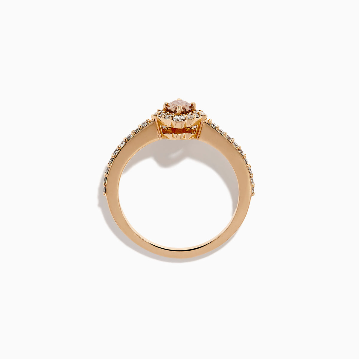 The 14K Rose Gold Brown and White Diamond Marquise Halo Ring features a marquise-cut brown and white diamond centerpiece, accented by round diamonds in a halo and along the band.