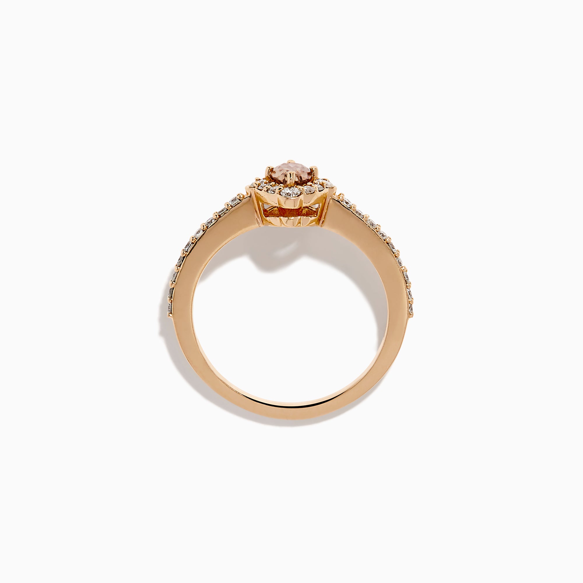 The 14K Rose Gold Brown and White Diamond Marquise Halo Ring features a marquise-cut brown and white diamond centerpiece, accented by round diamonds in a halo and along the band.