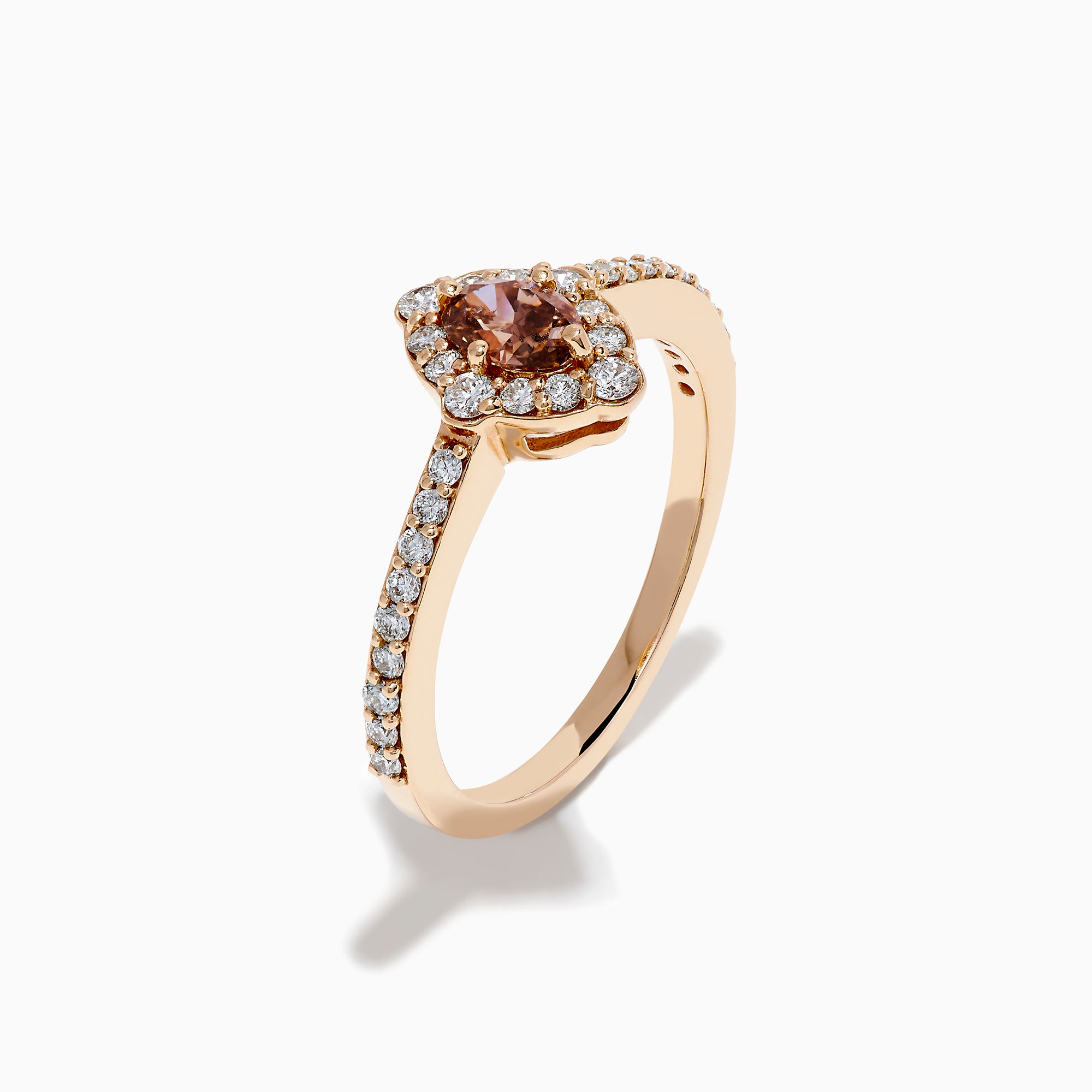 The 14K Rose Gold Brown and White Diamond Marquise Halo Ring features a marquise-cut brown and white diamond centerpiece, accented by round diamonds in a halo and along the band.