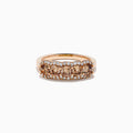 The 14K Rose Gold Cushion Cut 5 Stone Brown Diamond Band showcases five brown cushion-cut diamonds accented by round white diamonds, creating an elegant and sophisticated look.