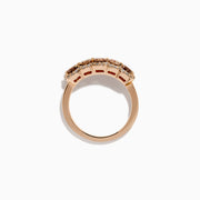 The 14K Rose Gold Cushion Cut 5 Stone Brown Diamond Band showcases five brown cushion-cut diamonds accented by round white diamonds, creating an elegant and sophisticated look.