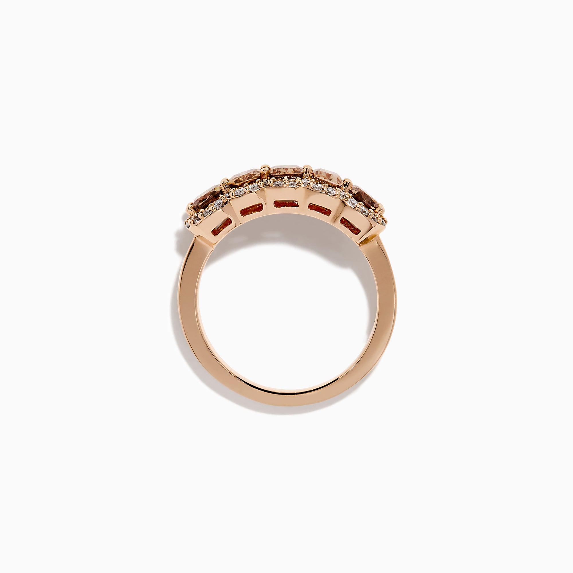 The 14K Rose Gold Cushion Cut 5 Stone Brown Diamond Band showcases five brown cushion-cut diamonds accented by round white diamonds, creating an elegant and sophisticated look.