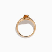 The 14K Rose Gold Brown and White Diamond Ring features a rectangular orange gemstone at the center, accented by two rows of sparkling white diamonds that gracefully curve and split around the vibrant stone.