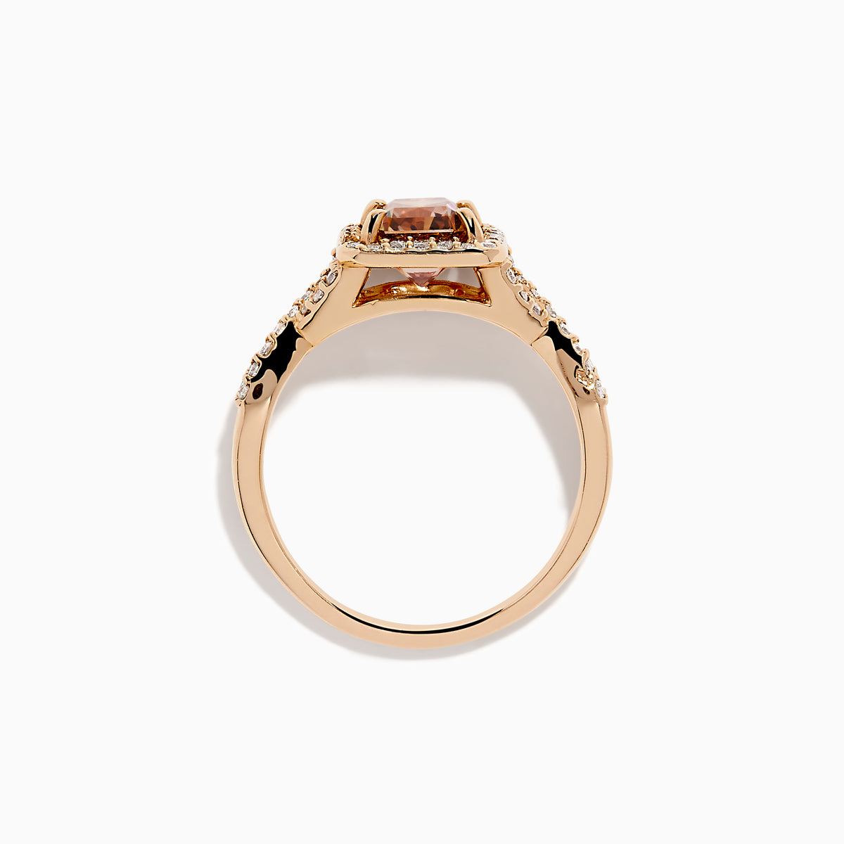 The Espresso 14K Rose Gold Brown Diamond Ring features a stunning brown diamond center with a halo of white diamonds and additional diamonds accenting its elegant twisted band.