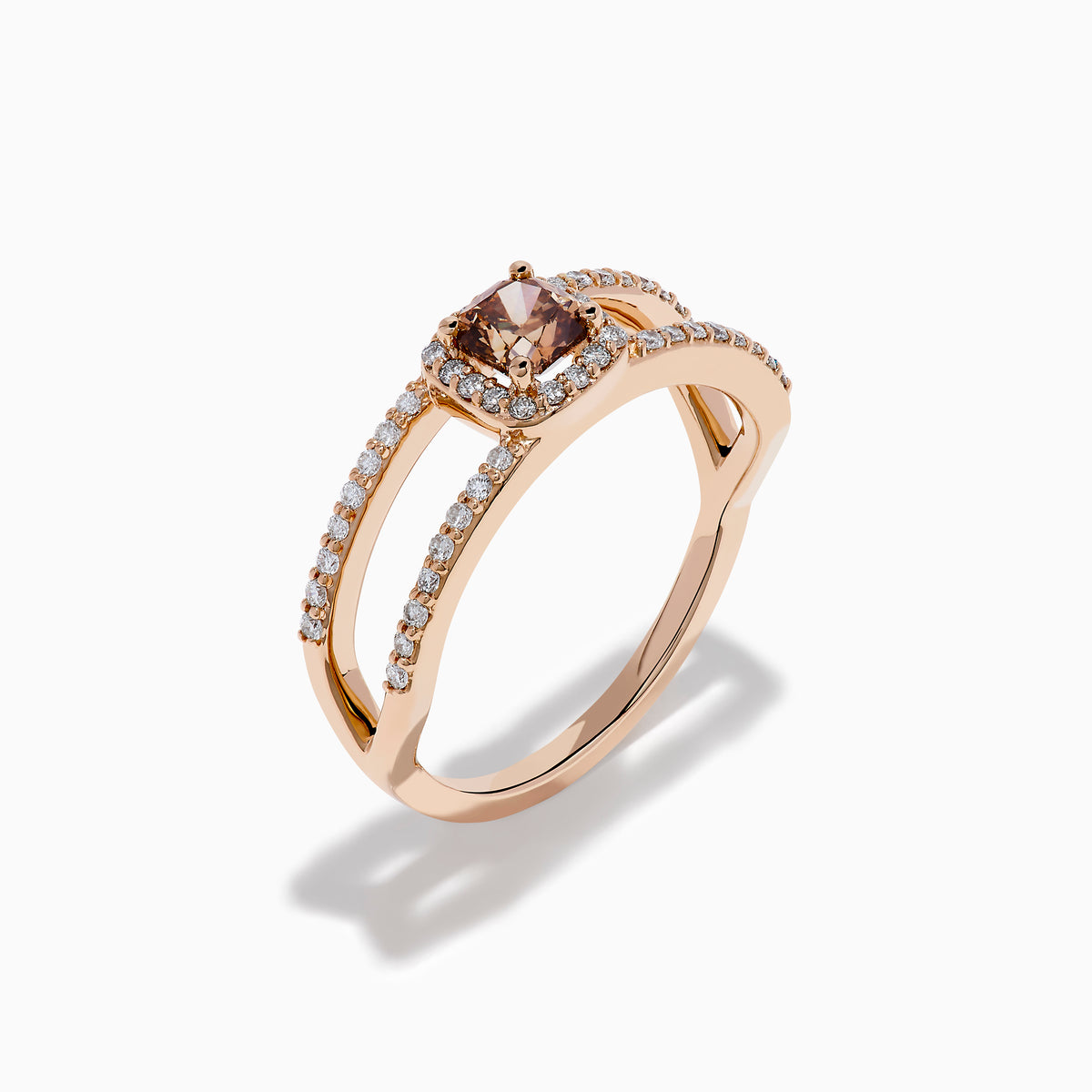 The Espresso 14K Rose Gold Brown Diamond Ring showcases a rectangular cushion-cut center stone, haloed by diamonds, and features a double band adorned with sparkling brown diamonds.