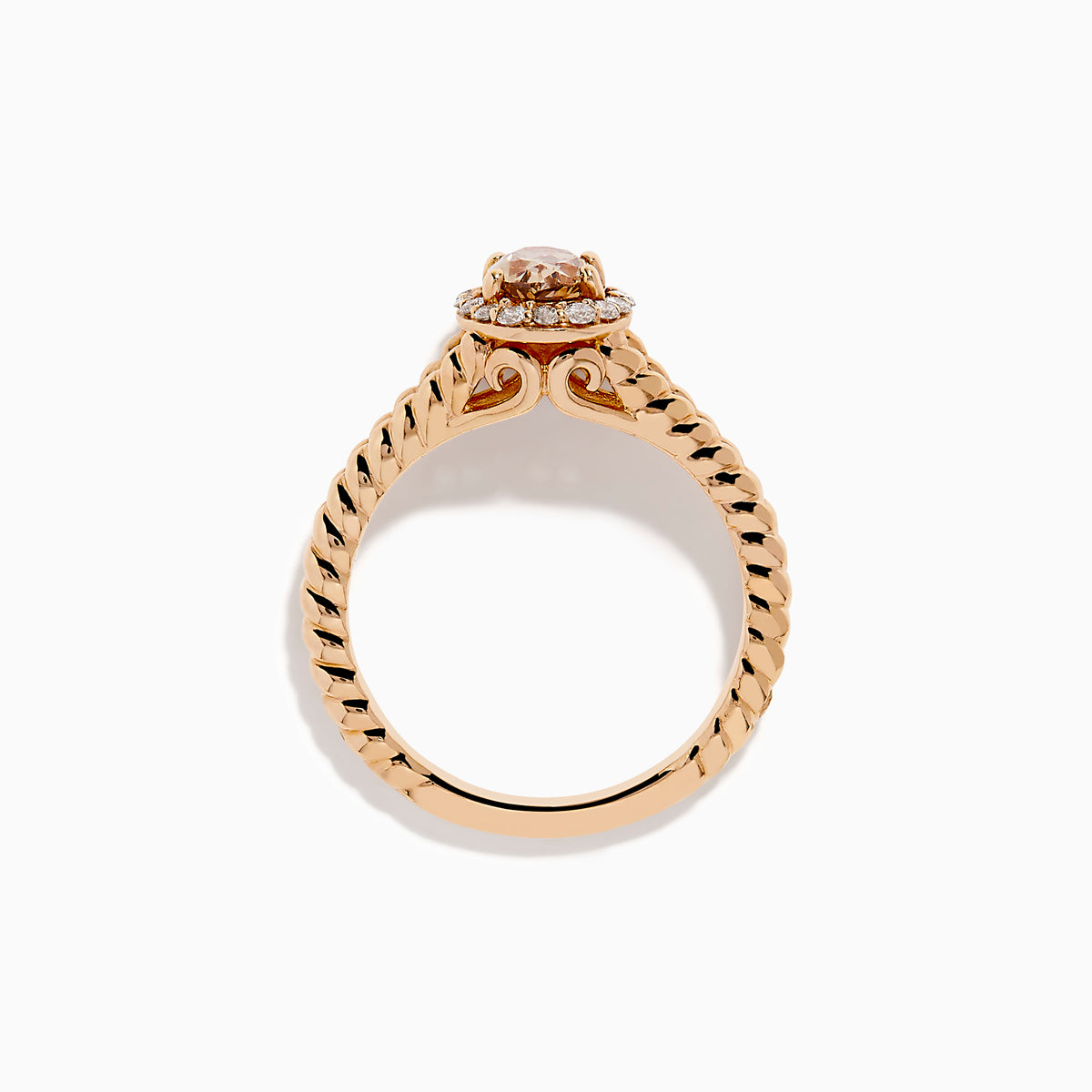 The Espresso 14K Rose Gold Brown Diamond Ring features an oval light brown diamond surrounded by a halo of small white diamonds and set on a twisted rose gold band.
