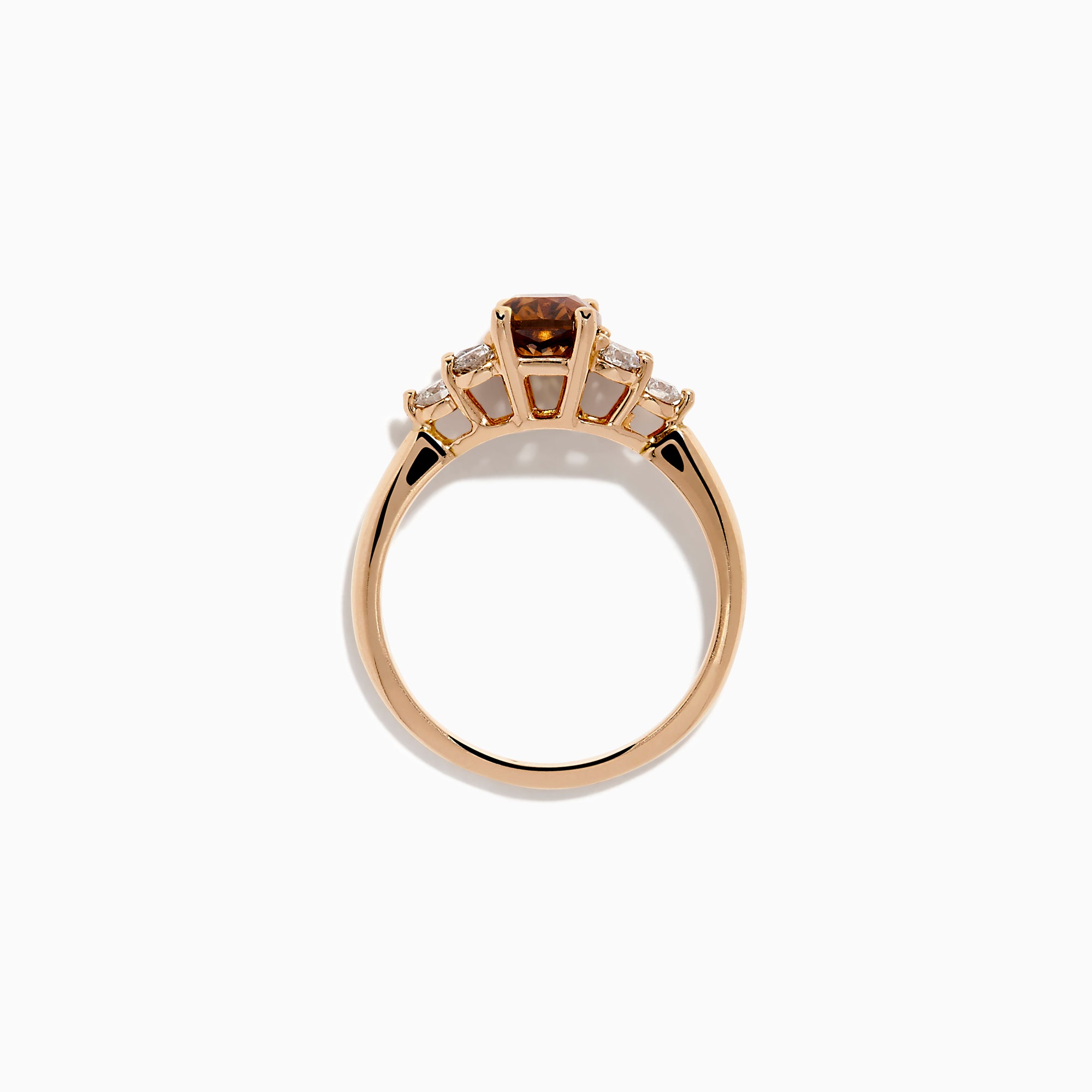 The 14K Rose Gold Brown and White Diamond Ring features a rectangular brown gemstone at the center with three round white diamonds on each side, all set in a simple rose gold band against a white background.