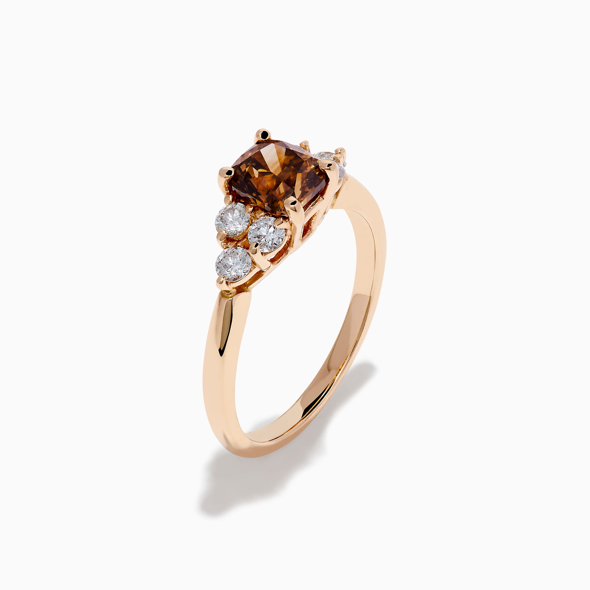 The 14K Rose Gold Brown and White Diamond Ring features a rectangular brown gemstone at the center with three round white diamonds on each side, all set in a simple rose gold band against a white background.