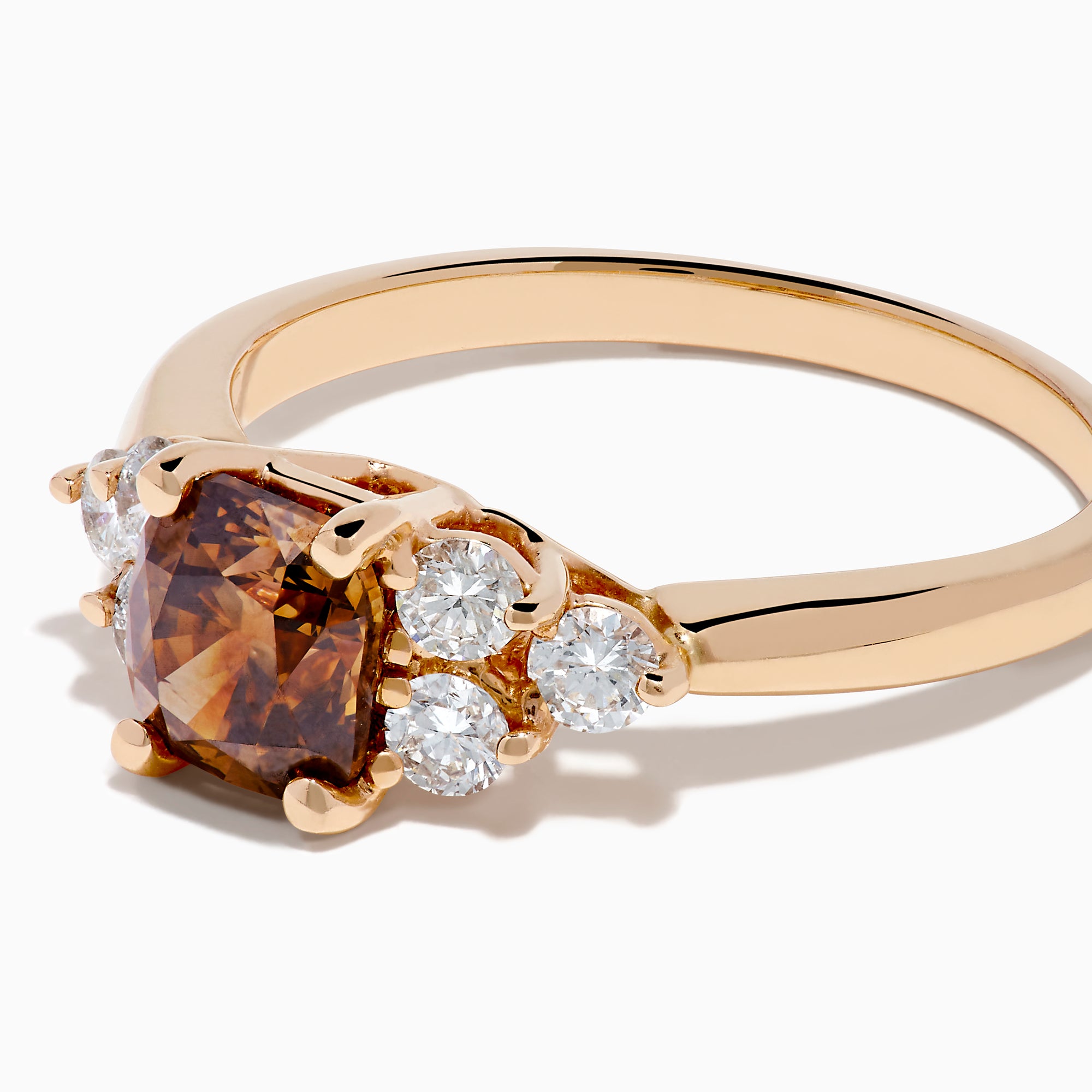 The 14K Rose Gold Brown and White Diamond Ring features a rectangular brown gemstone at the center with three round white diamonds on each side, all set in a simple rose gold band against a white background.
