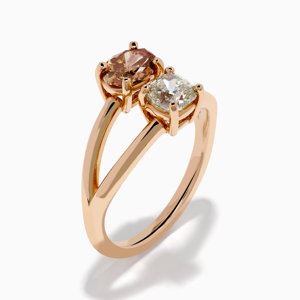 The Espresso 14K Rose Gold Brown and White Diamond Ring showcases two side-by-side stones—a round brown diamond and a white diamond—set on a split rose gold band, shown against a white background.