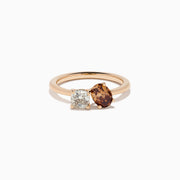 The 14K Rose Gold Brown and White Diamond Toi et Moi Ring features a square-cut white diamond and a round brown diamond set side by side in minimalist prongs on a slender band.
