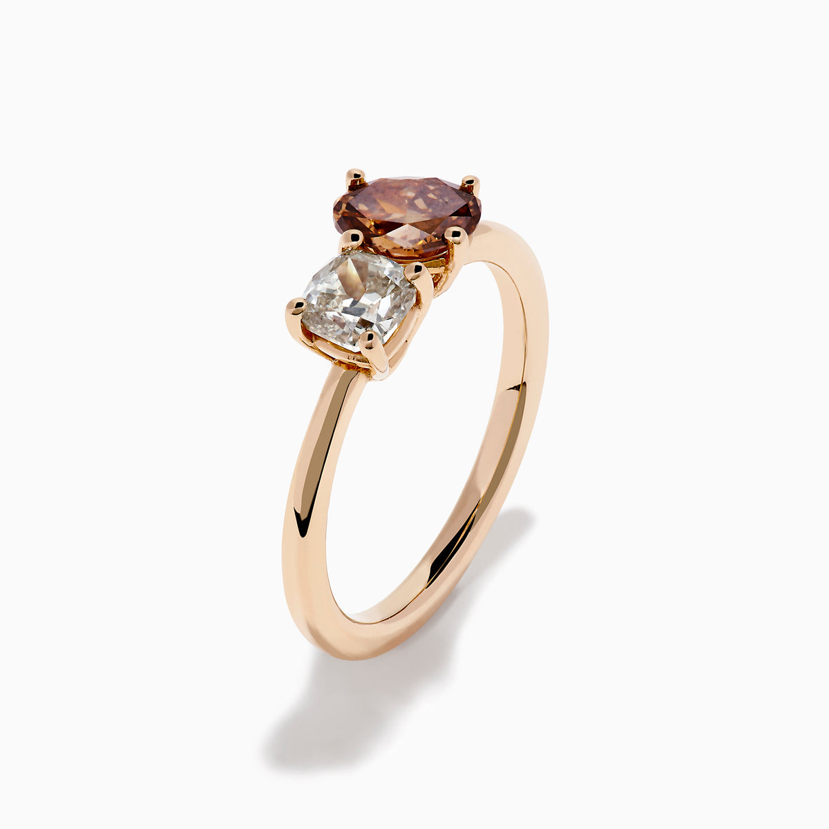 The 14K Rose Gold Brown and White Diamond Toi et Moi Ring features a square-cut white diamond and a round brown diamond set side by side in minimalist prongs on a slender band.