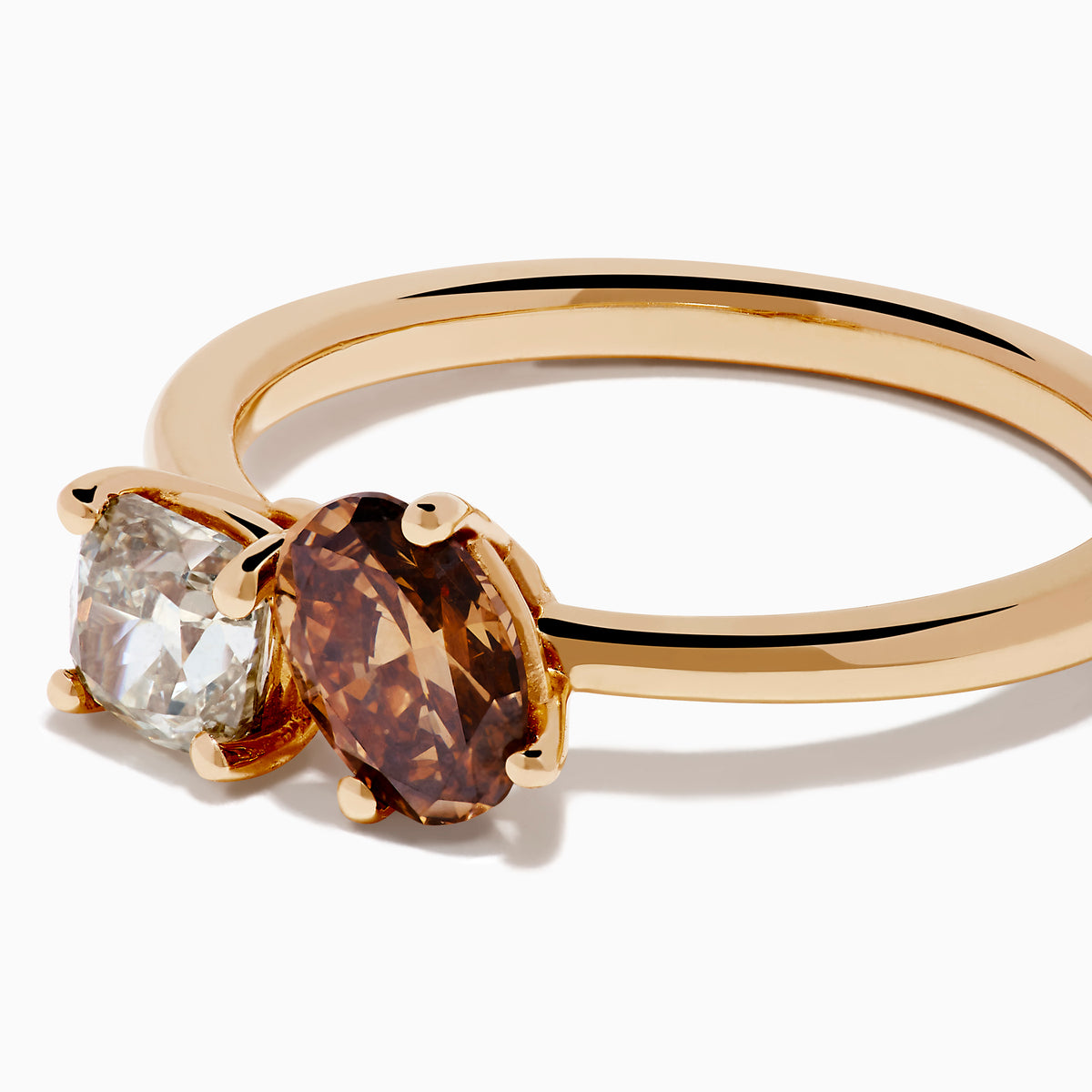 The 14K Rose Gold Brown and White Diamond Toi et Moi Ring features a square-cut white diamond and a round brown diamond set side by side in minimalist prongs on a slender band.