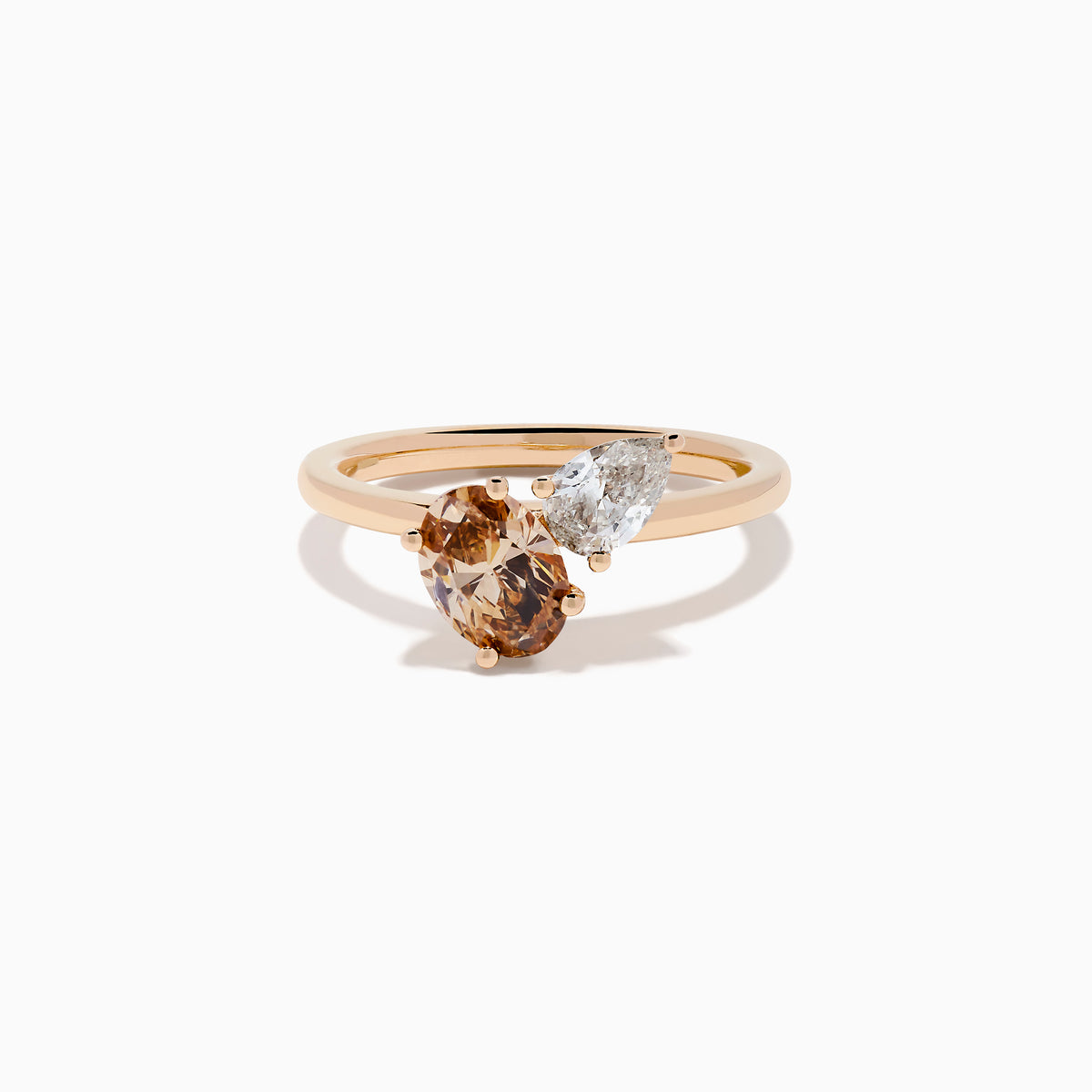 The 14K Rose Gold Brown and White Diamond Toi et Moi Ring features two side-by-side round diamonds—one brown, one white—set on a simple gold band.