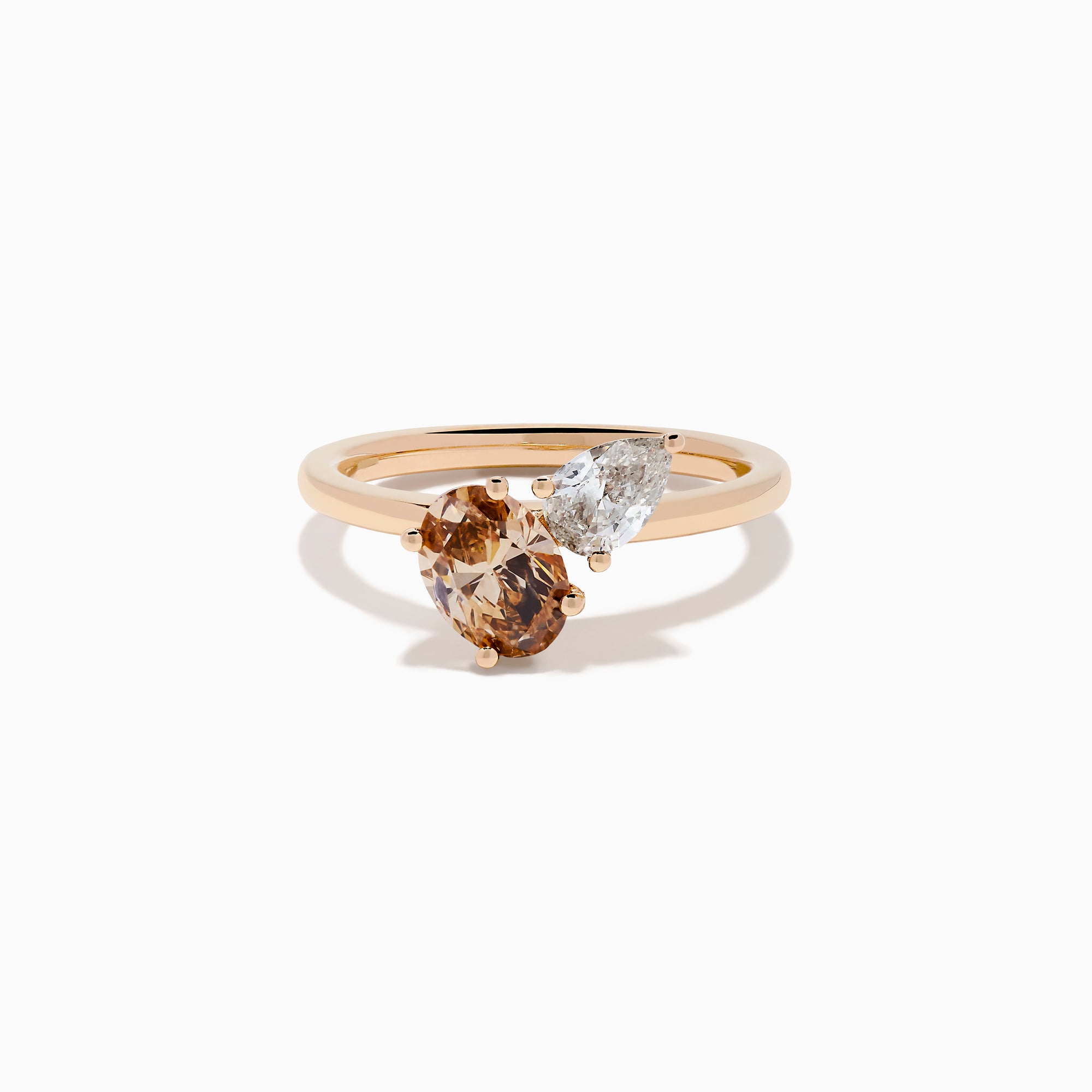 The 14K Rose Gold Brown and White Diamond Toi et Moi Ring features two side-by-side round diamonds—one brown, one white—set on a simple gold band.
