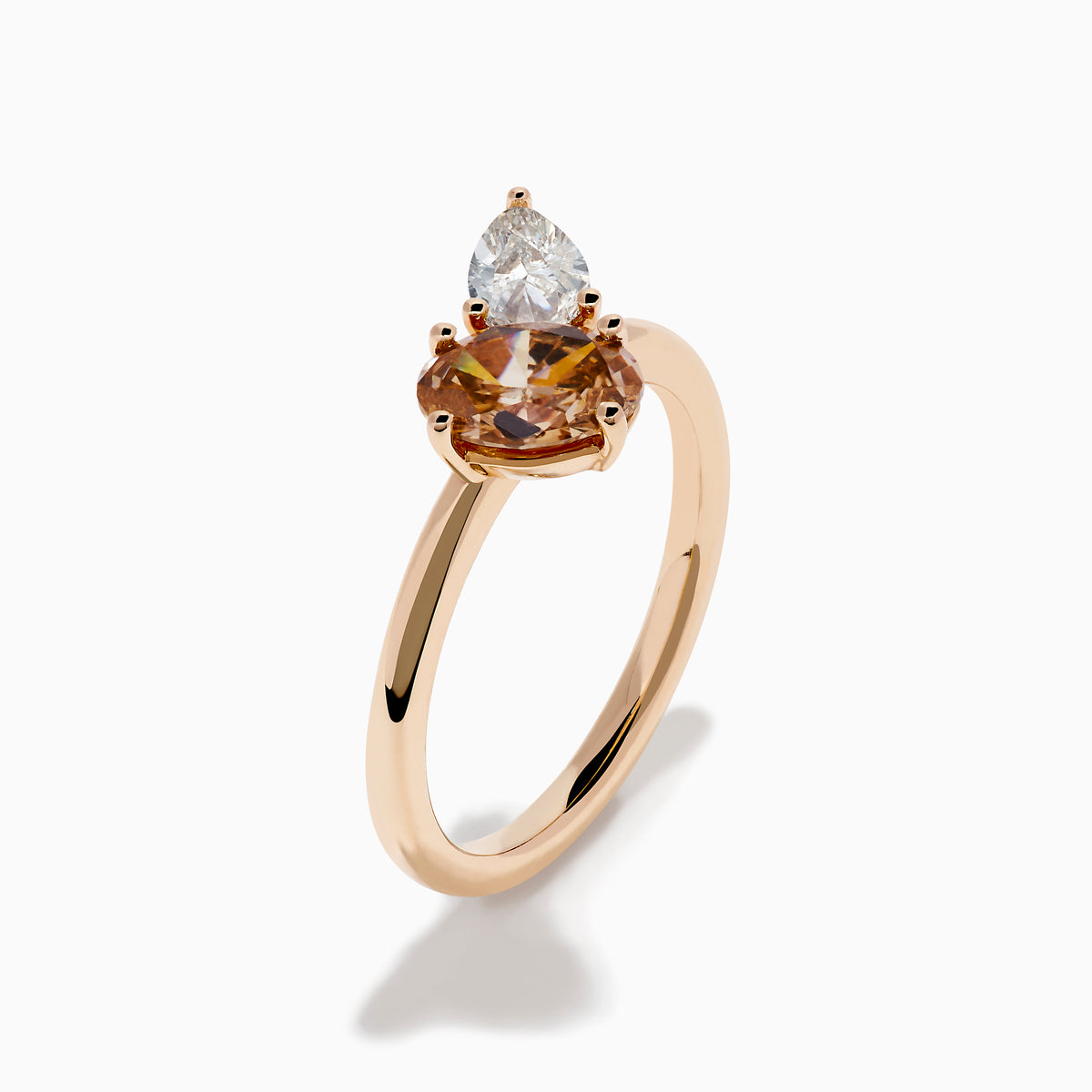 The 14K Rose Gold Brown and White Diamond Toi et Moi Ring features two side-by-side round diamonds—one brown, one white—set on a simple gold band.