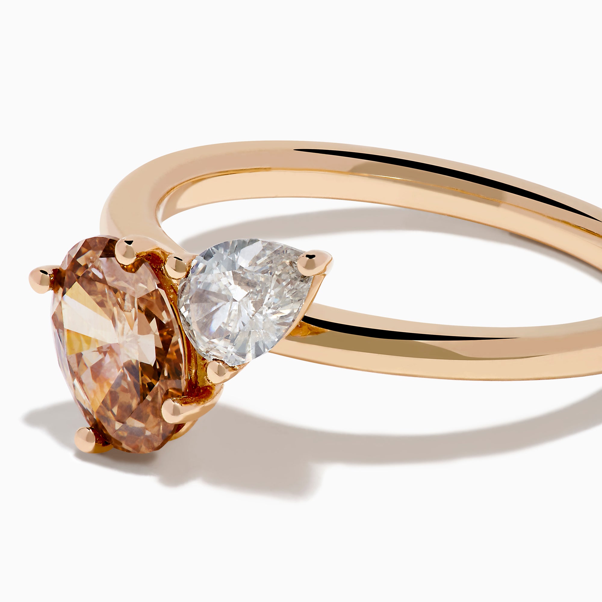 The 14K Rose Gold Brown and White Diamond Toi et Moi Ring features two side-by-side round diamonds—one brown, one white—set on a simple gold band.