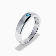 The Men's 14K White Gold Blue Diamond Ring showcases a single round blue diamond set into a sleek white gold band, shown on a plain white background.