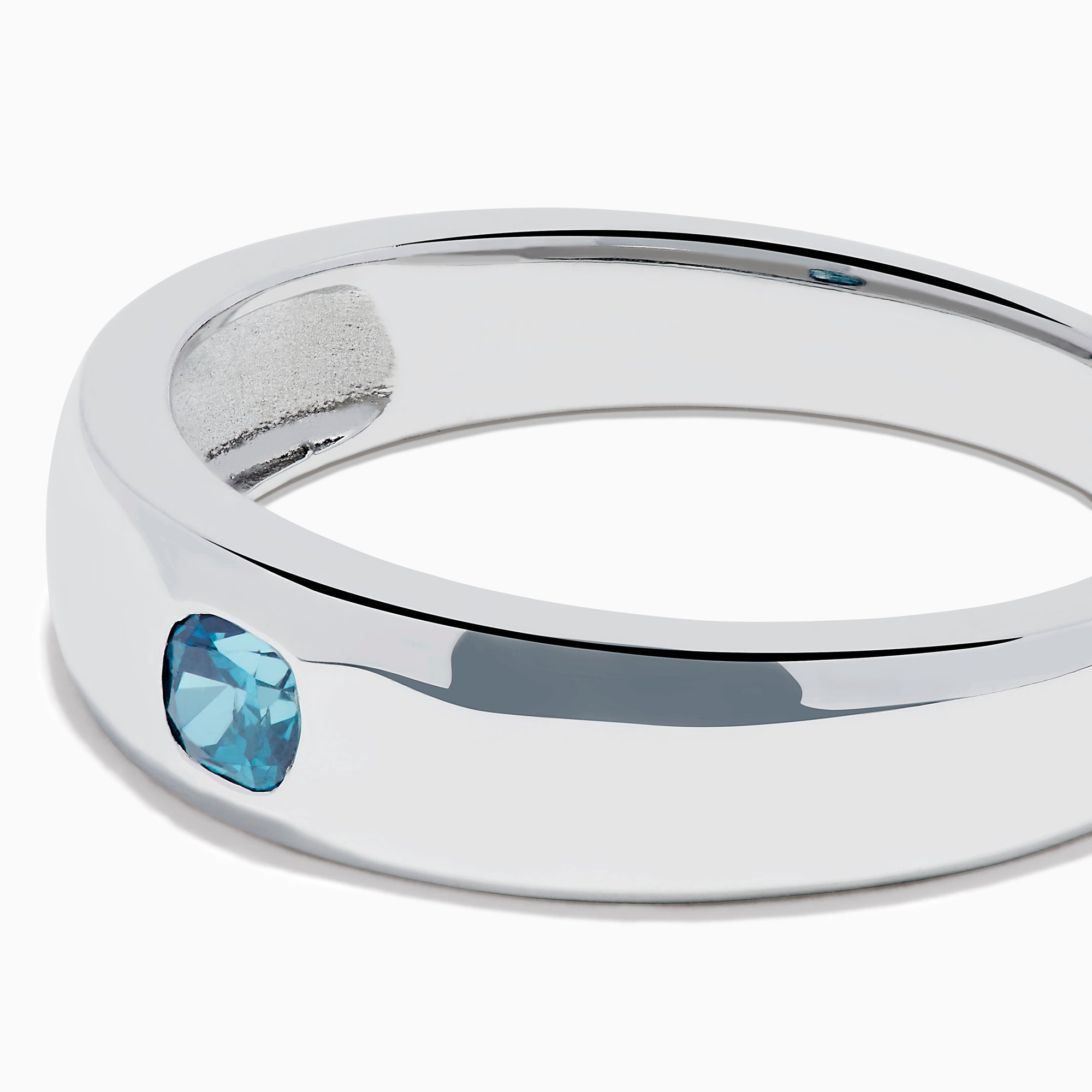The Men's 14K White Gold Blue Diamond Ring showcases a single round blue diamond set into a sleek white gold band, shown on a plain white background.