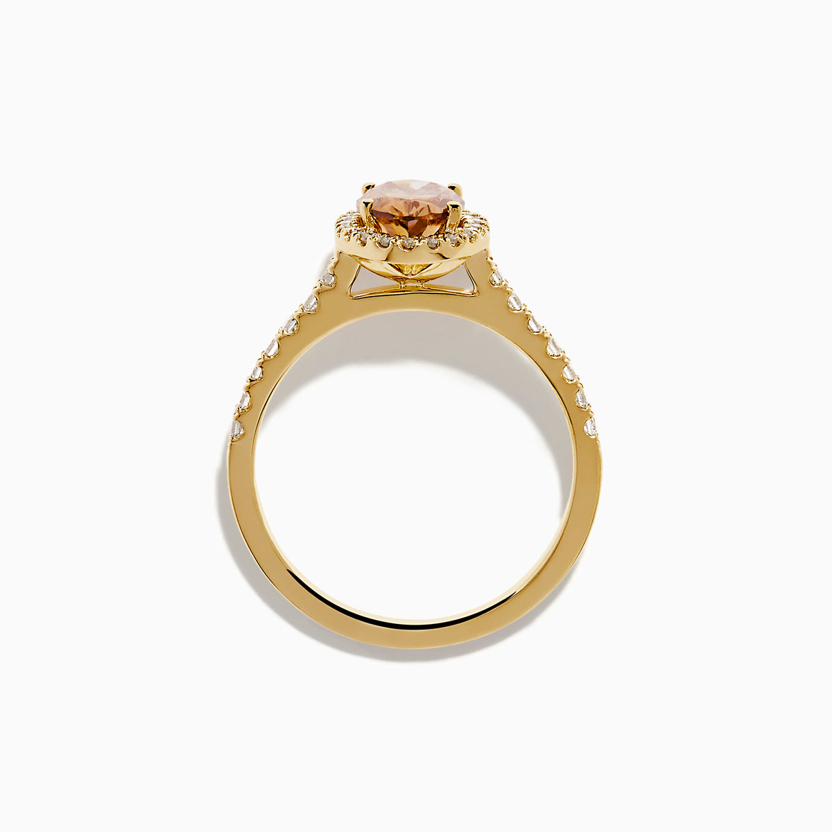The Espresso 14K Yellow Gold Brown Diamond Halo Ring showcases an oval brown diamond center, encircled by a halo of white diamonds with additional diamonds set along the band.