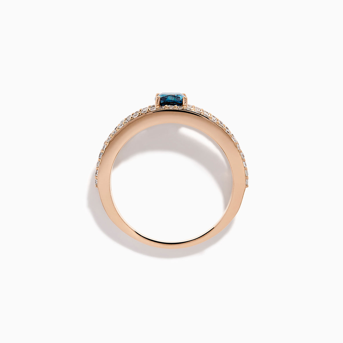 The Bella Bleu 14K Rose Gold Blue and White Diamond Ring features two parallel, diamond-encrusted bands and a cushion-cut blue gemstone centerpiece. This modern, elegant ring stands out beautifully against a crisp white background.