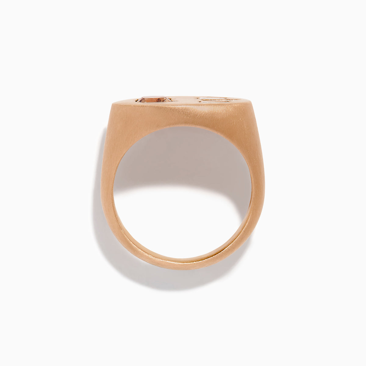 The Espresso 14K Rose Gold Brown and White Diamond Signet Ring showcases a round brown and white diamond on the left and three vertical rectangular white gemstones on the right of its flat top.