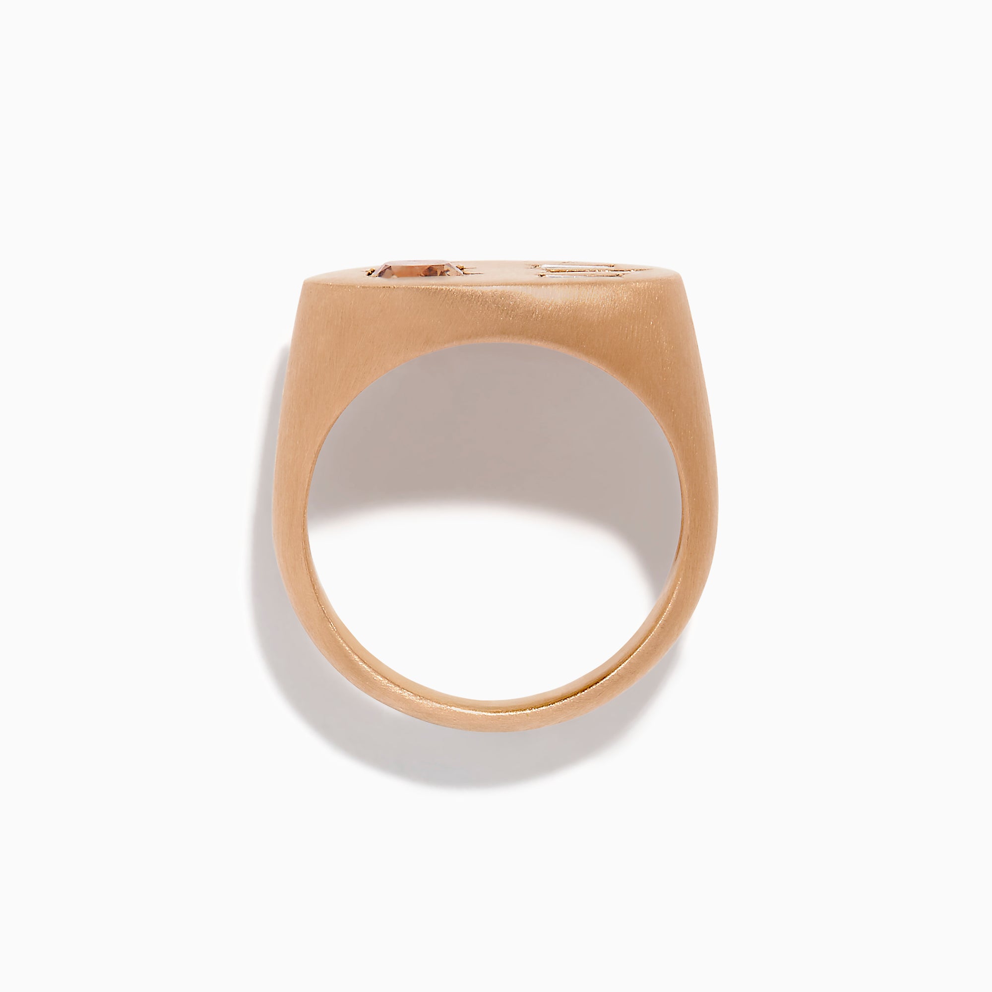 The Espresso 14K Rose Gold Brown and White Diamond Signet Ring showcases a round brown and white diamond on the left and three vertical rectangular white gemstones on the right of its flat top.