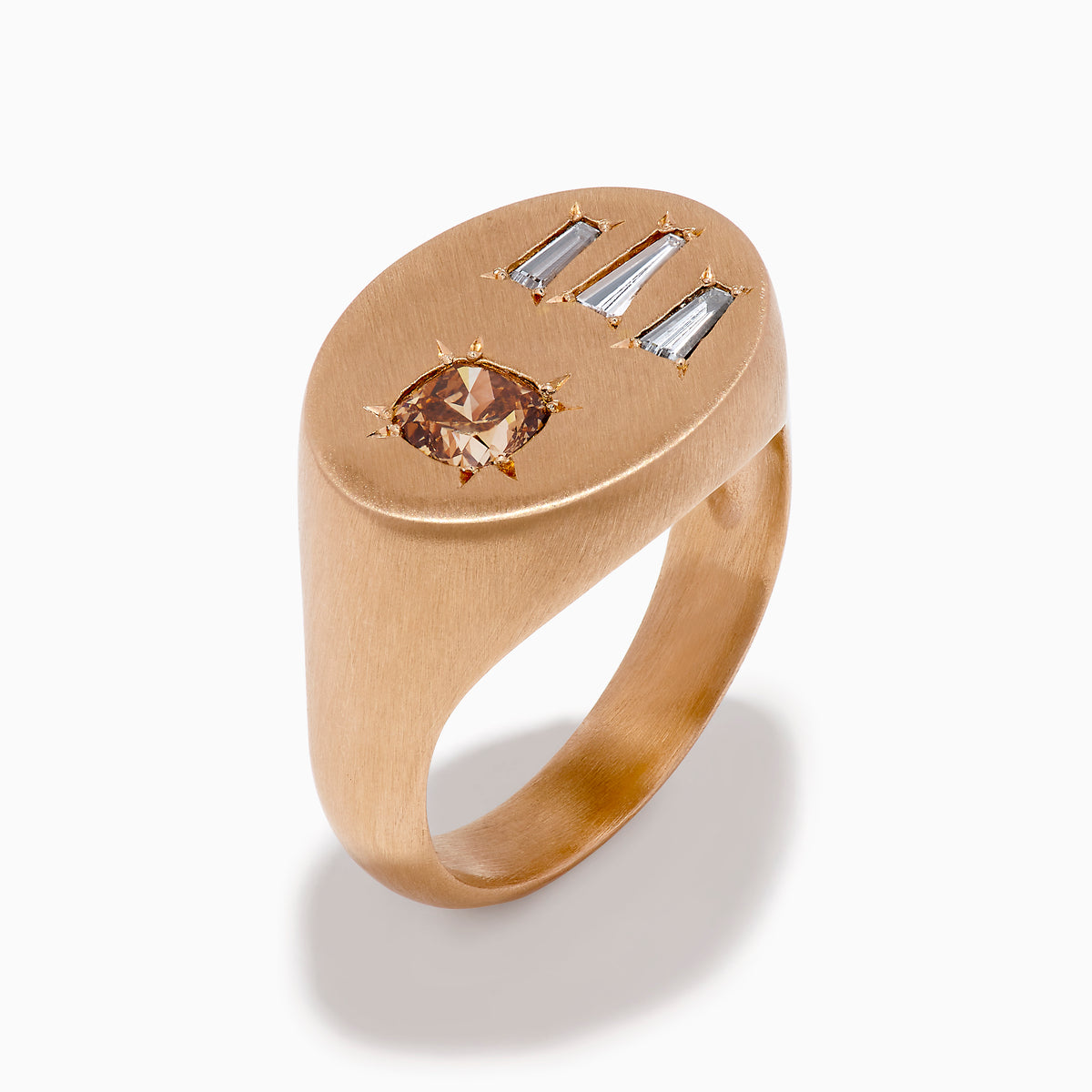 The Espresso 14K Rose Gold Brown and White Diamond Signet Ring showcases a round brown and white diamond on the left and three vertical rectangular white gemstones on the right of its flat top.
