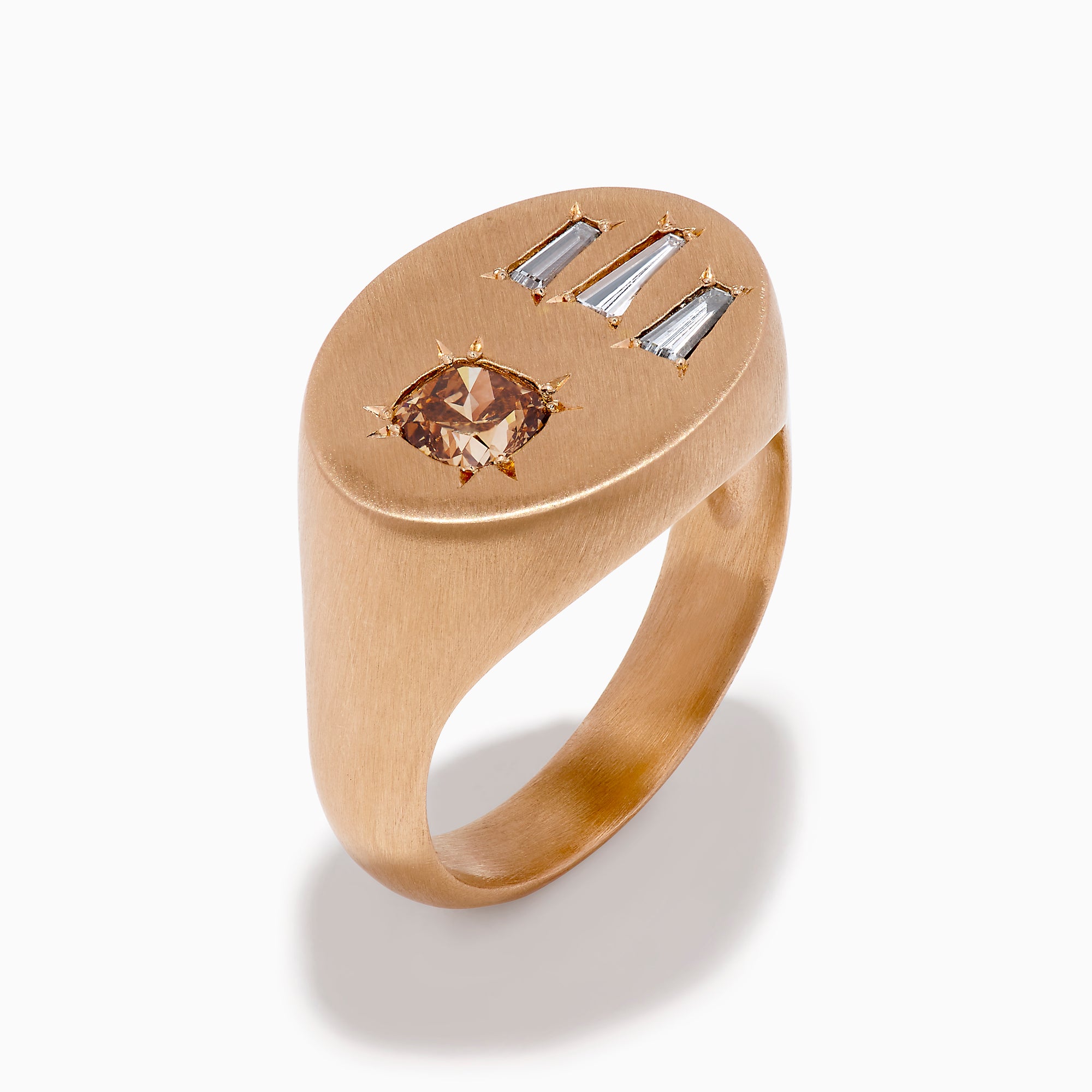The Espresso 14K Rose Gold Brown and White Diamond Signet Ring showcases a round brown and white diamond on the left and three vertical rectangular white gemstones on the right of its flat top.