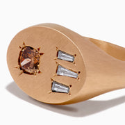 The Espresso 14K Rose Gold Brown and White Diamond Signet Ring showcases a round brown and white diamond on the left and three vertical rectangular white gemstones on the right of its flat top.