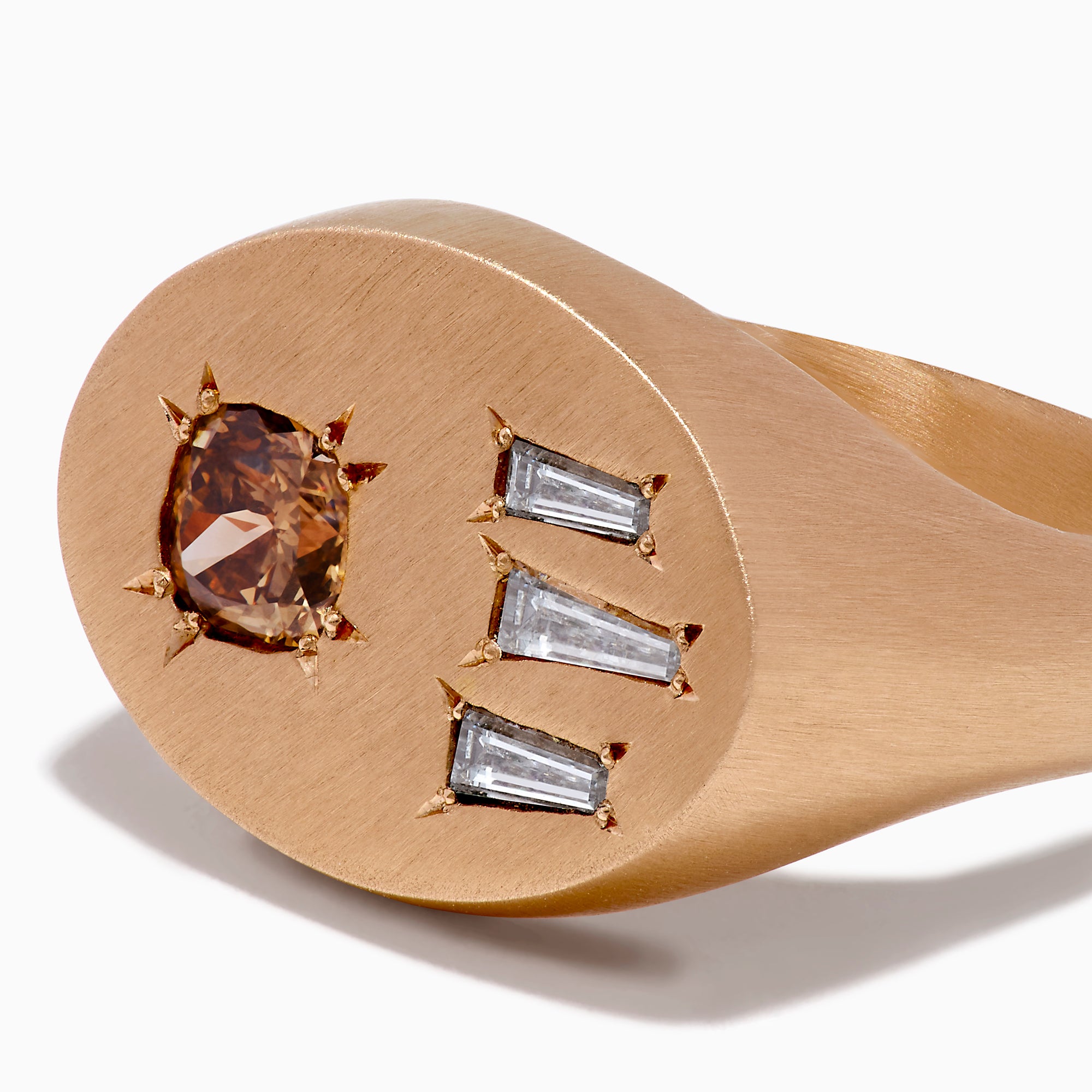 The Espresso 14K Rose Gold Brown and White Diamond Signet Ring showcases a round brown and white diamond on the left and three vertical rectangular white gemstones on the right of its flat top.
