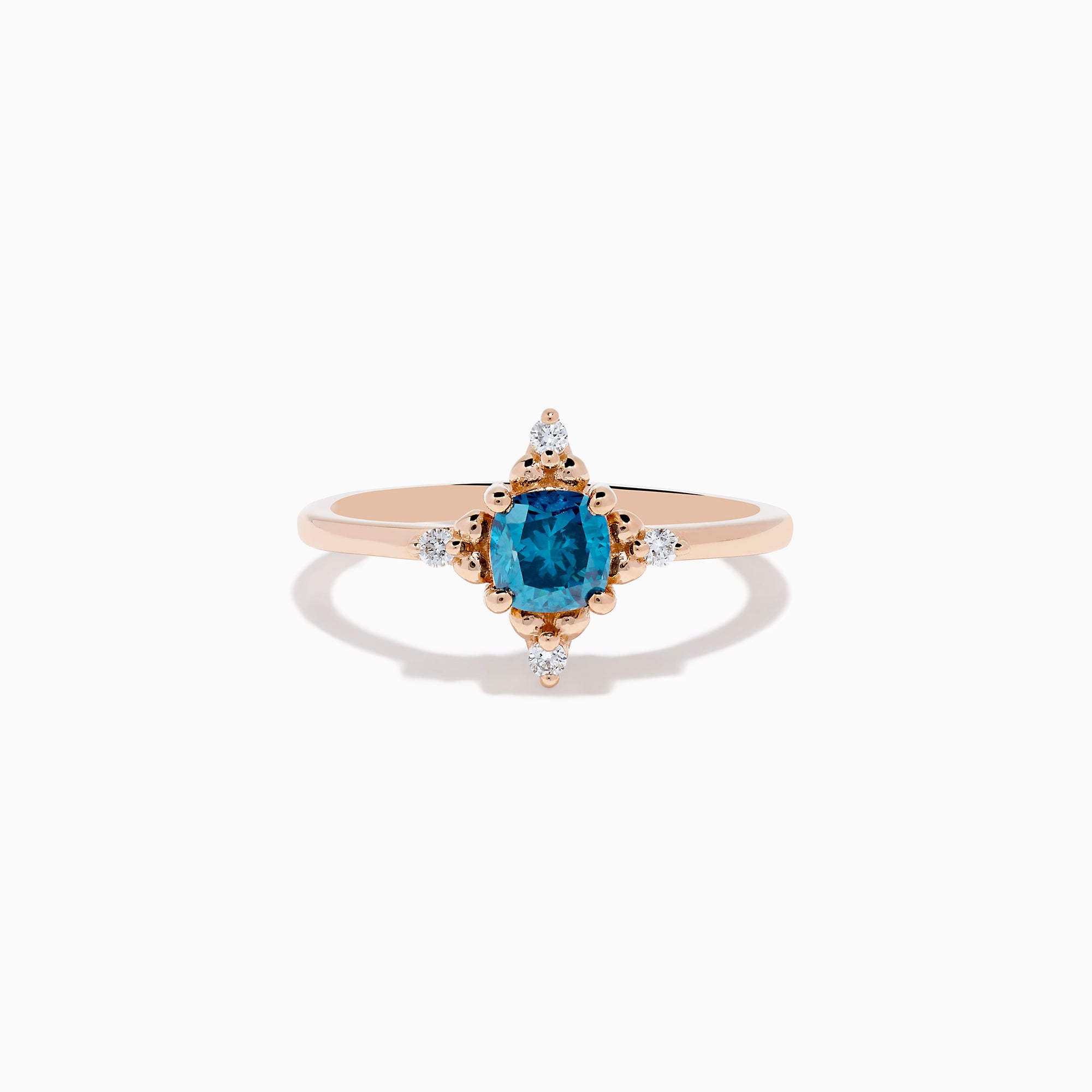 The Bella Bleu 14K Rose Gold Blue and White Diamond Ring features a cushion-cut blue gemstone at its center, accented by four symmetrically placed round white diamonds.