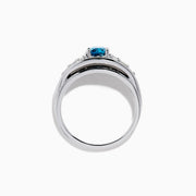 The Bella Bleu 14K White Gold Blue and White Diamond Ring showcases a vibrant square-cut blue center stone, accented by rows of round white diamonds on each side, displayed on a white background.