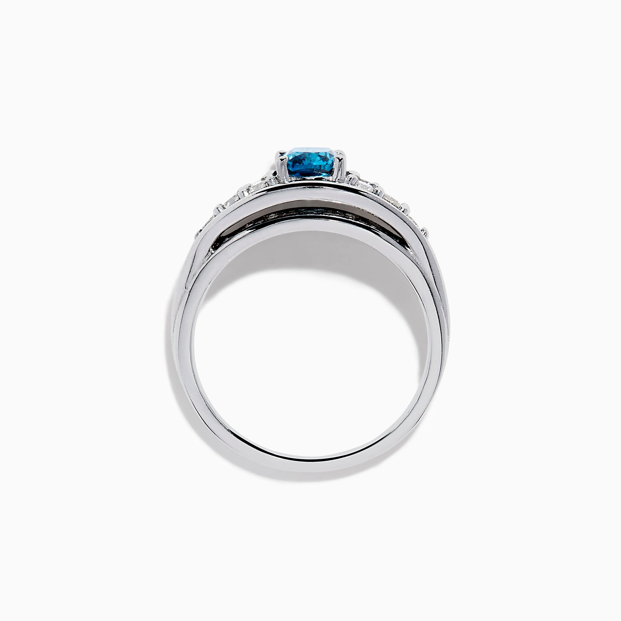 The Bella Bleu 14K White Gold Blue and White Diamond Ring showcases a vibrant square-cut blue center stone, accented by rows of round white diamonds on each side, displayed on a white background.