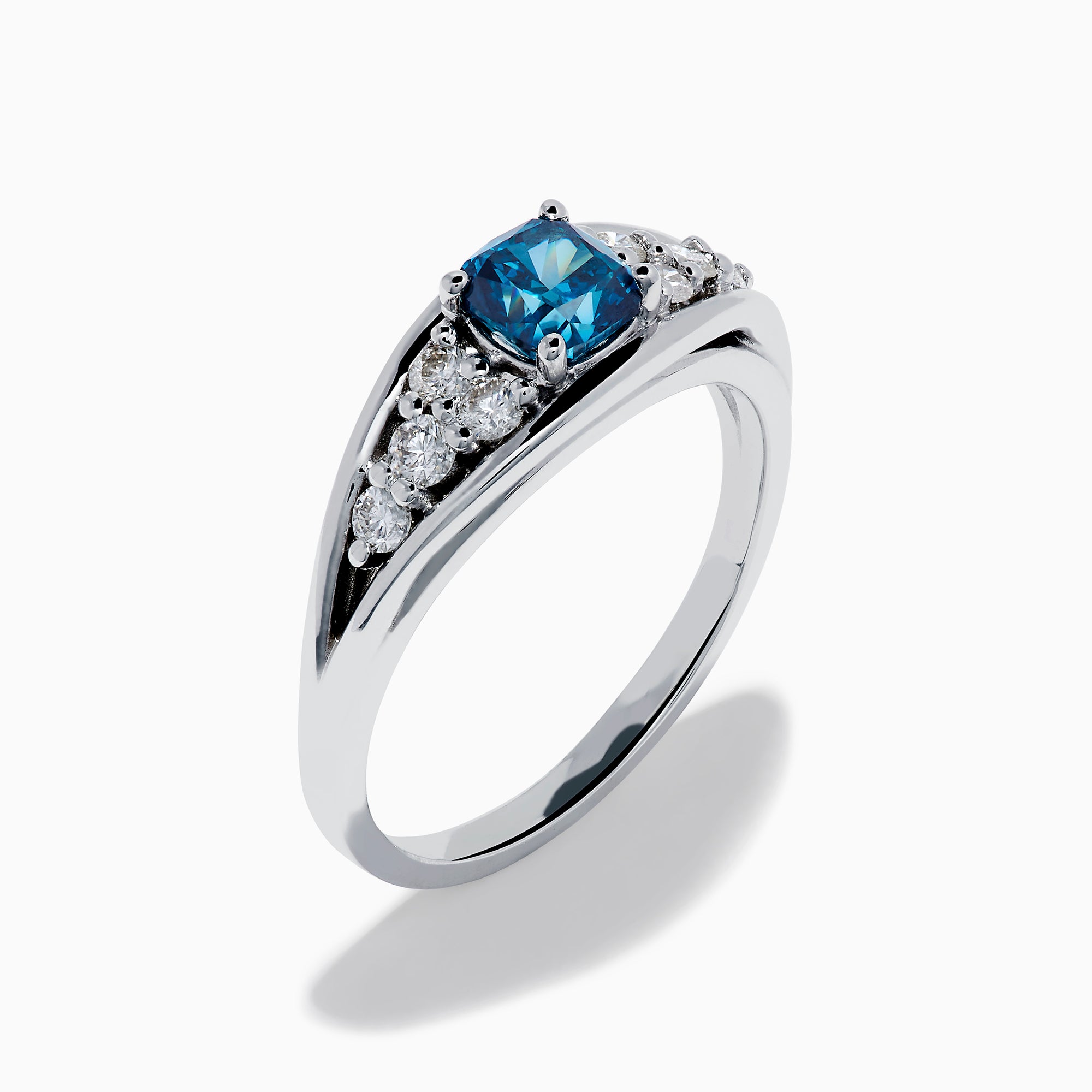 The Bella Bleu 14K White Gold Blue and White Diamond Ring showcases a vibrant square-cut blue center stone, accented by rows of round white diamonds on each side, displayed on a white background.