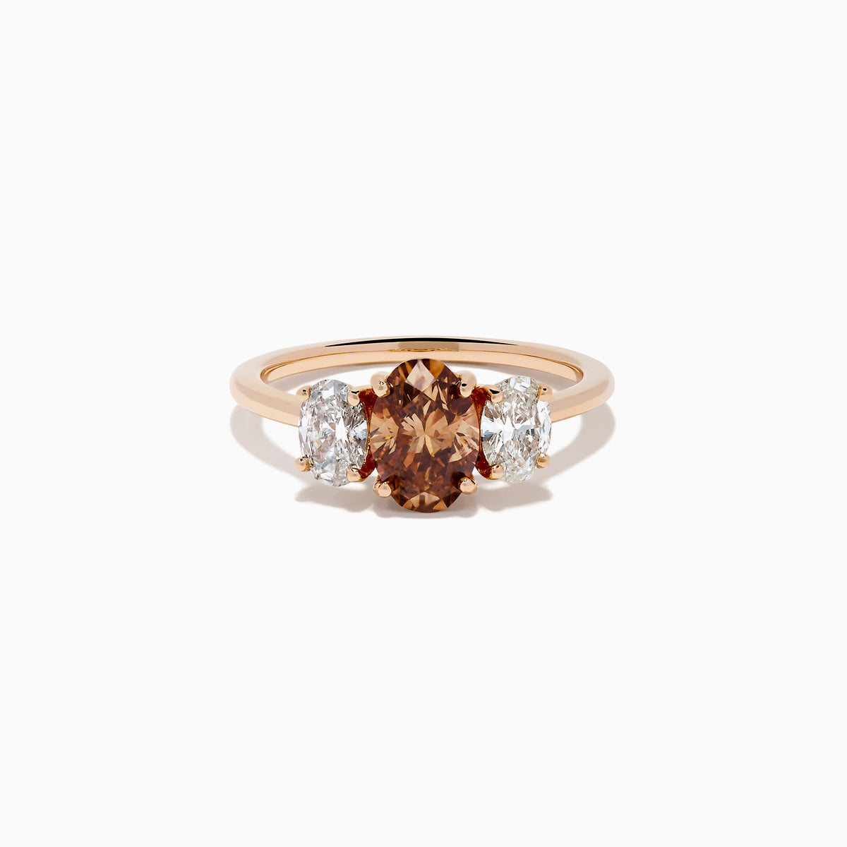 A close-up of the 14K Rose Gold Brown and White Diamond 3 Stone Ring, showcasing its beautiful brown and white diamonds in an elegant setting.