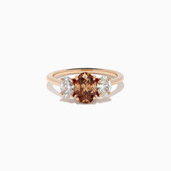 A close-up of the 14K Rose Gold Brown and White Diamond 3 Stone Ring, showcasing its beautiful brown and white diamonds in an elegant setting.