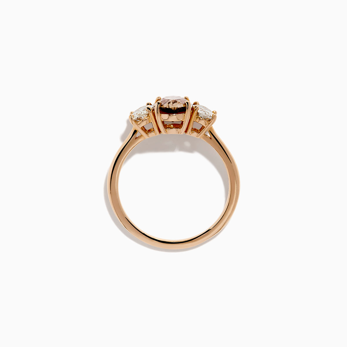 A close-up of the 14K Rose Gold Brown and White Diamond 3 Stone Ring, showcasing its beautiful brown and white diamonds in an elegant setting.