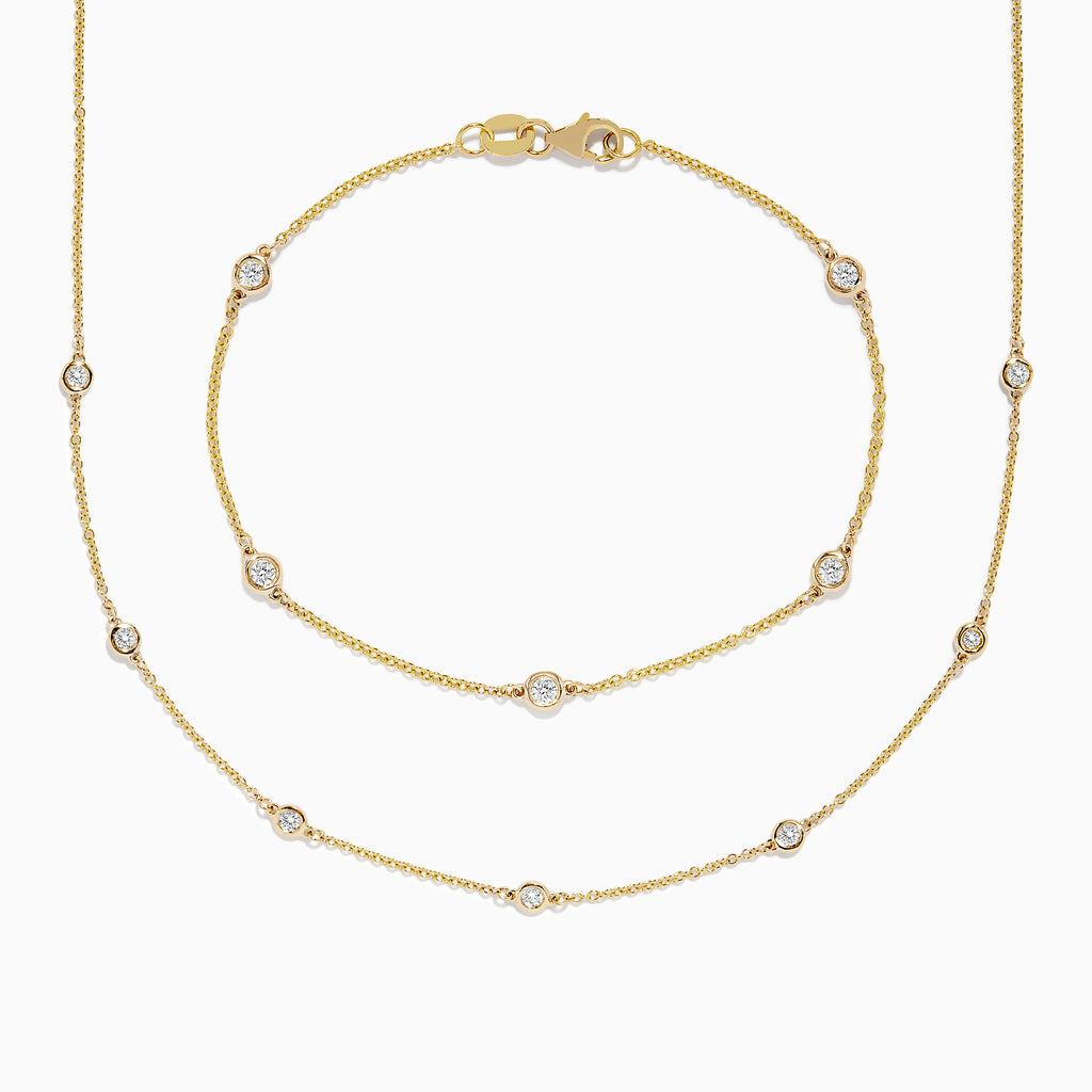 The DOro 14K Gold Diamond Station Necklace and Bracelet Set (0.59 TCW) features evenly spaced round diamonds on delicate chains, beautifully displayed on a white background.