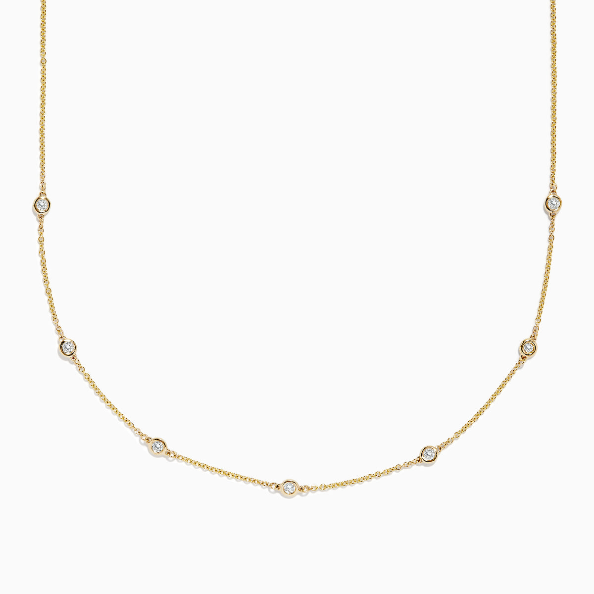 The DOro 14K Gold Diamond Station Necklace and Bracelet Set (0.59 TCW) features evenly spaced round diamonds on delicate chains, beautifully displayed on a white background.