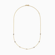 The DOro 14K Gold Diamond Station Necklace and Bracelet Set (0.59 TCW) features evenly spaced round diamonds on delicate chains, beautifully displayed on a white background.