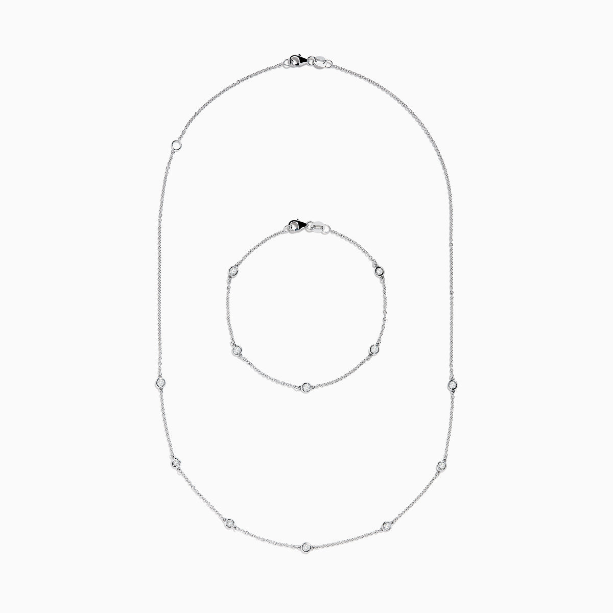 The Pave Classica 14K White Gold Diamond Bezel Station Necklace and Bracelet Set features small, evenly spaced round diamond accents, beautifully displayed on a plain white background.